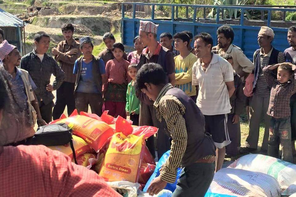 Distributing food and clothes for earthquake victim